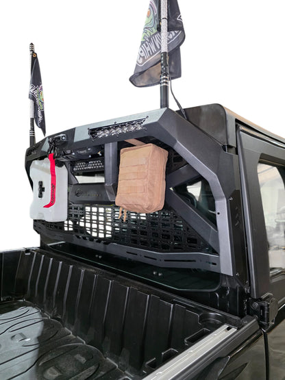 Truck bed with storage compartments and equipment, including a bag and a box.