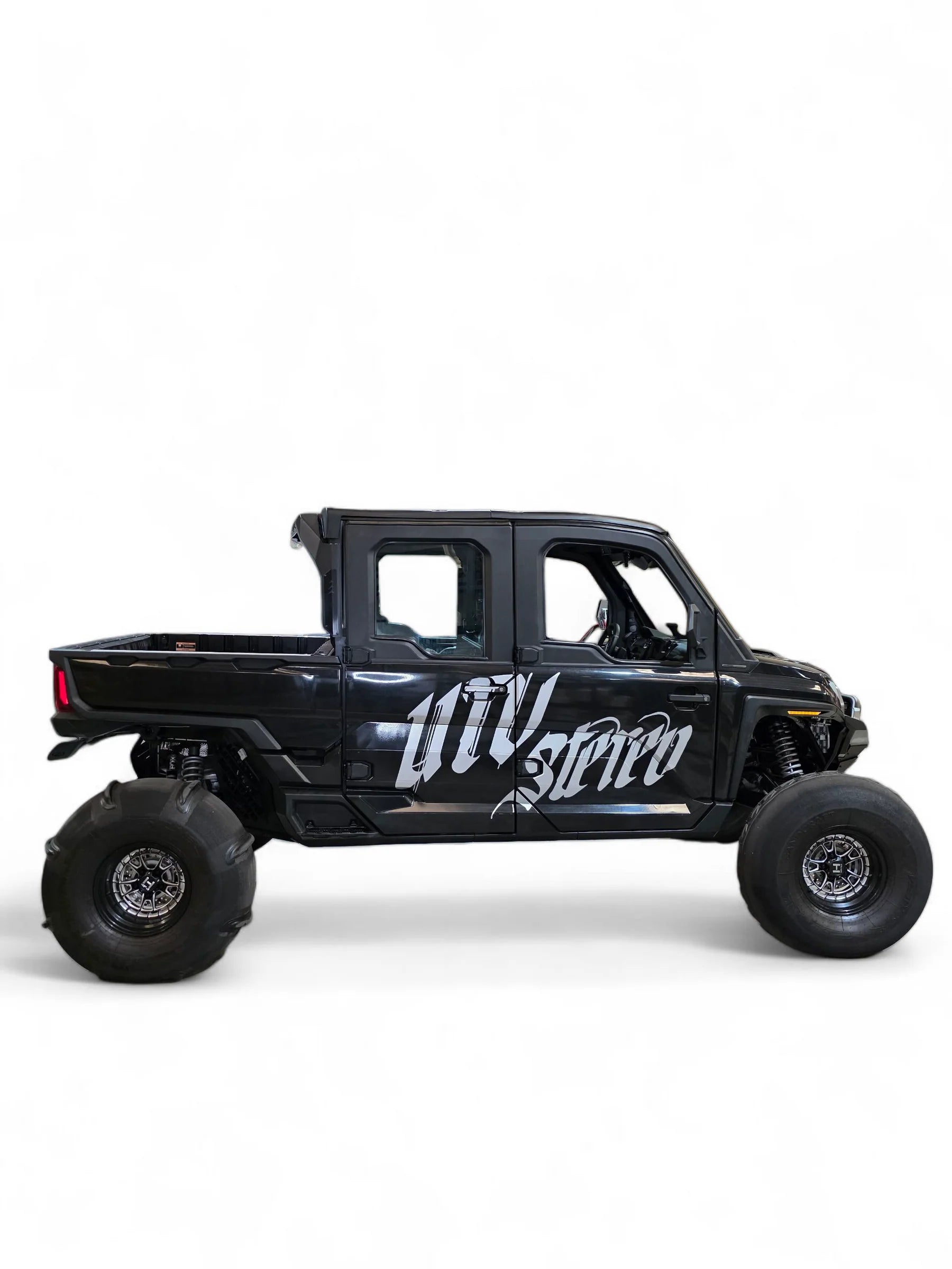 Black off-road vehicle with 'UTV Stereo' branding on a white background
