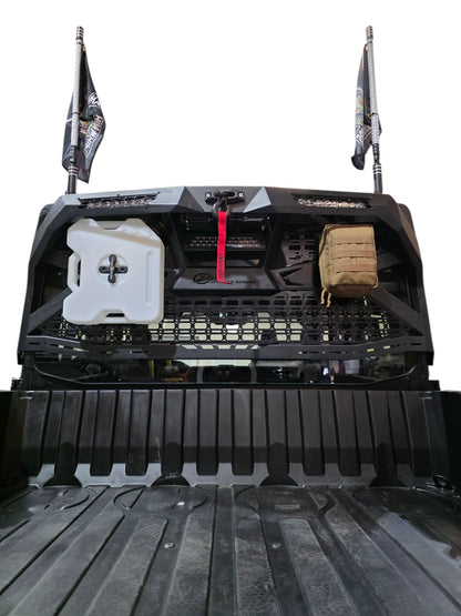 Back of a truck bed with storage compartments and equipment on a white background