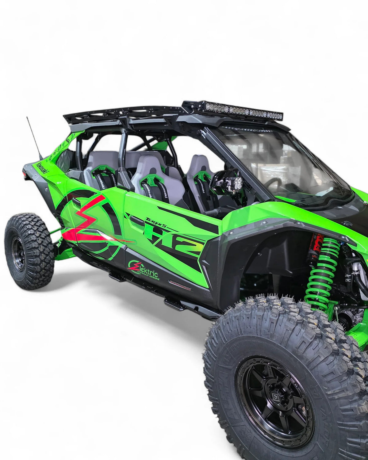 Side profile picture of Green UTV on white background