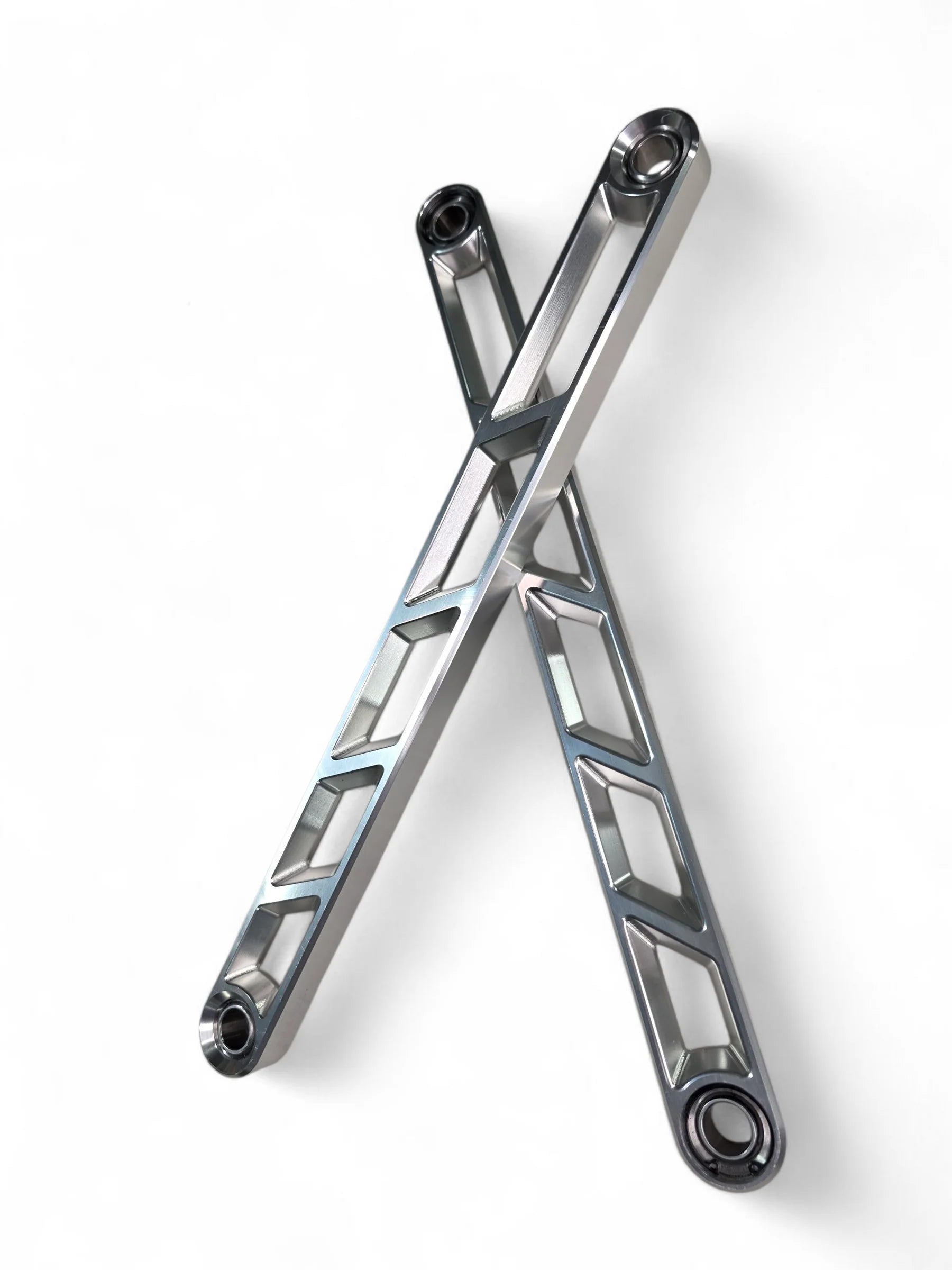 Elektric offroad Rear Sway Bar links crossed on white background