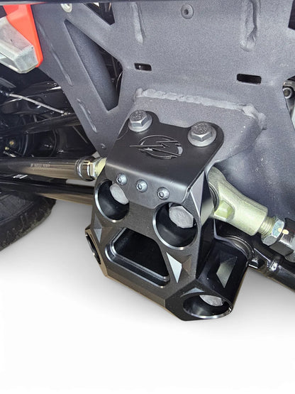 Close-up of a mechanical component on a vehicle, likely a suspension or steering part.