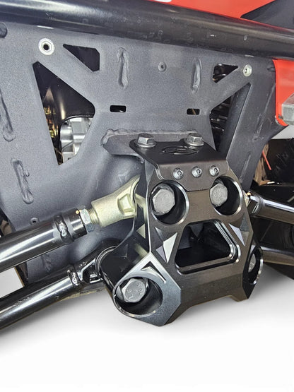 Close-up of a mechanical component with bolts and metal parts on a white background