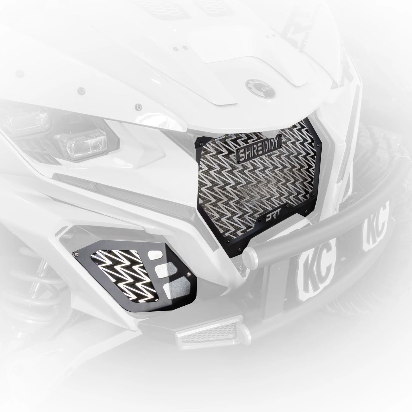 Close-up of a motorcycle with Shred Wax protective cover on a white background