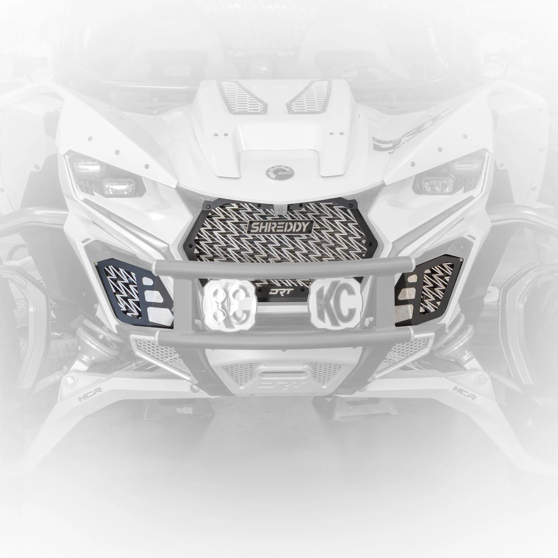 Close-up of a motorcycle grille with 'Shreddy' branding on a white background