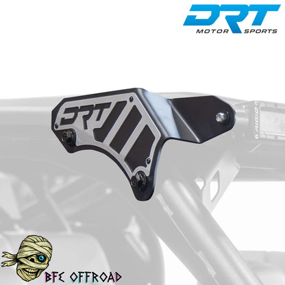 Metal protective guard on a vehicle frame with DRT Motor Sports branding.