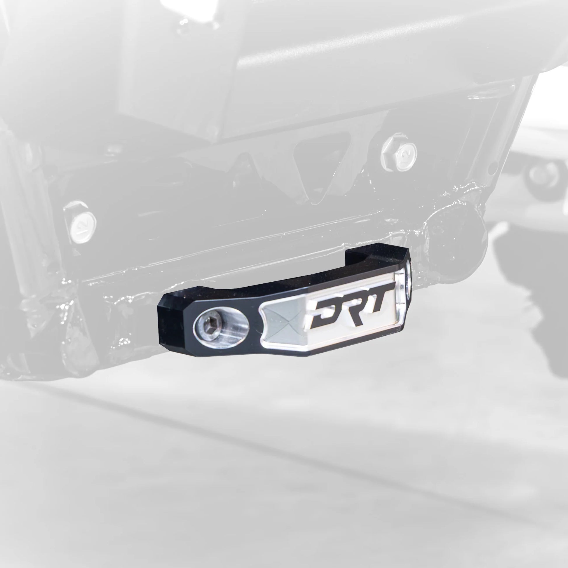 Black bumper with 'DRT' branding on a vehicle chassis.