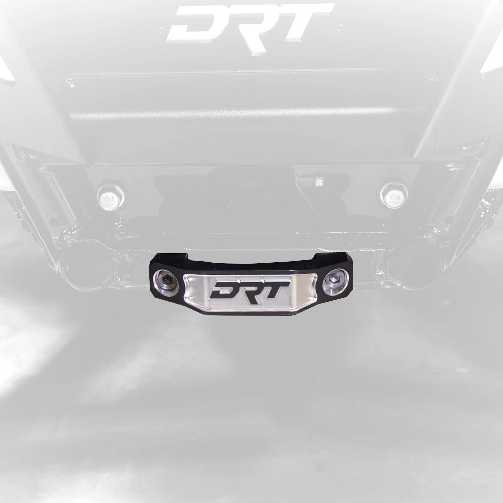 Close-up of a metallic surface with 'DRT' branding.