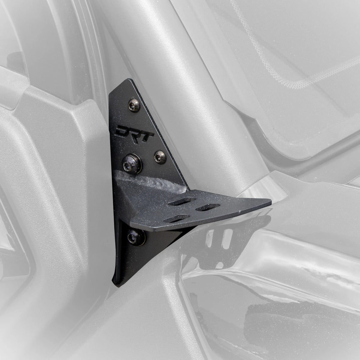Side view of bracket mounted on UTV with grey faded background