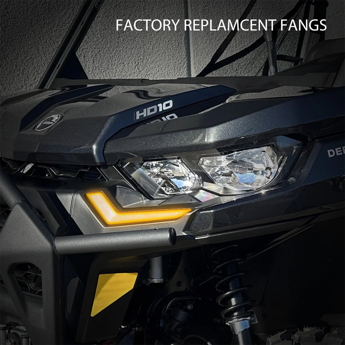 Close-up of a vehicle's headlight with 'Factory Replacement Fangs' text above.