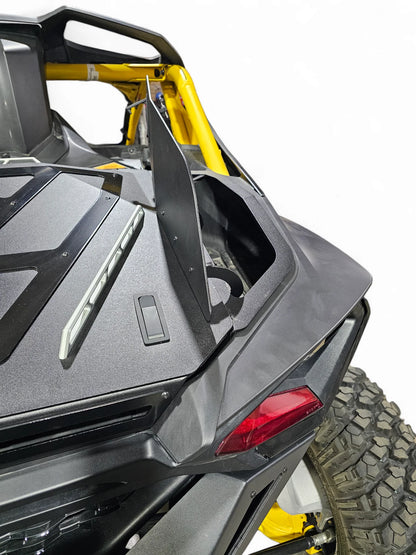 Close-up of a black and yellow off-road vehicle with a focus on the rear design.