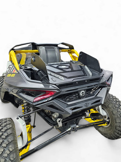 Side view of a gray and yellow off-road vehicle on a white background