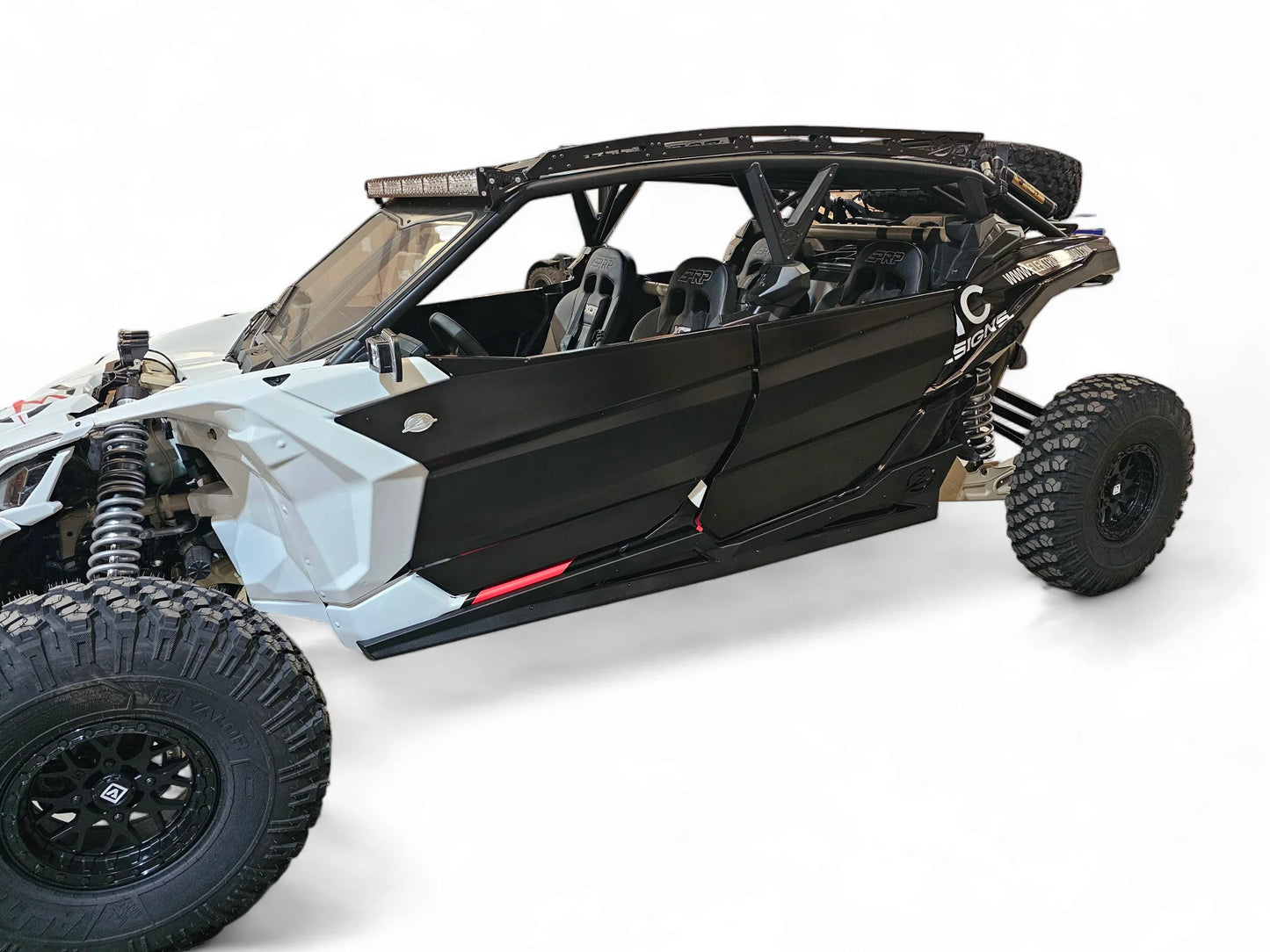 Black off-road vehicle with open doors on a white background