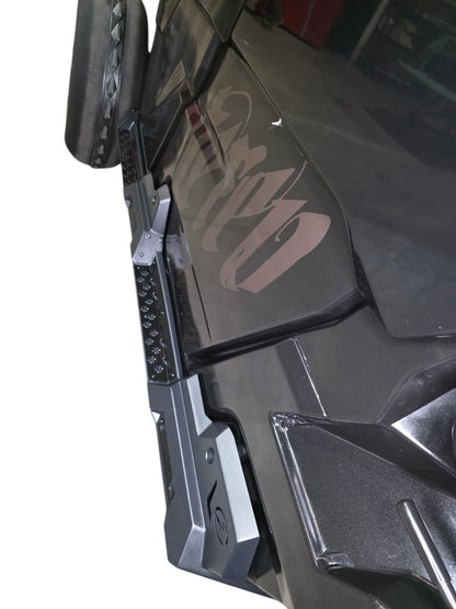 Close-up of a vehicle's side mirror and door panel with 'Urab' branding.