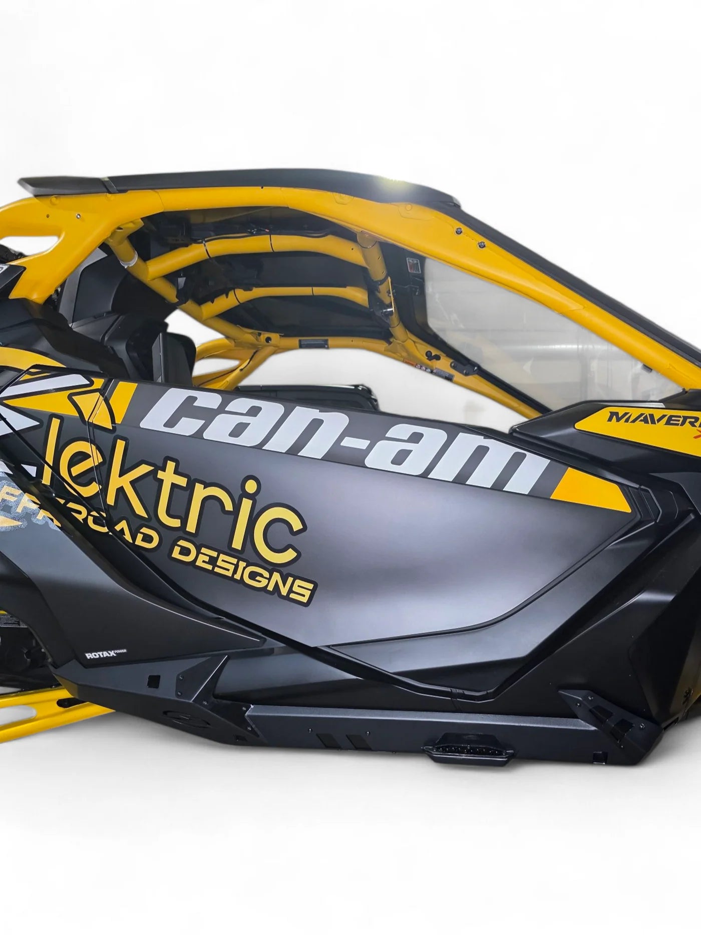 Yellow and black Can-Am vehicle with 'Elektric' branding on a white background