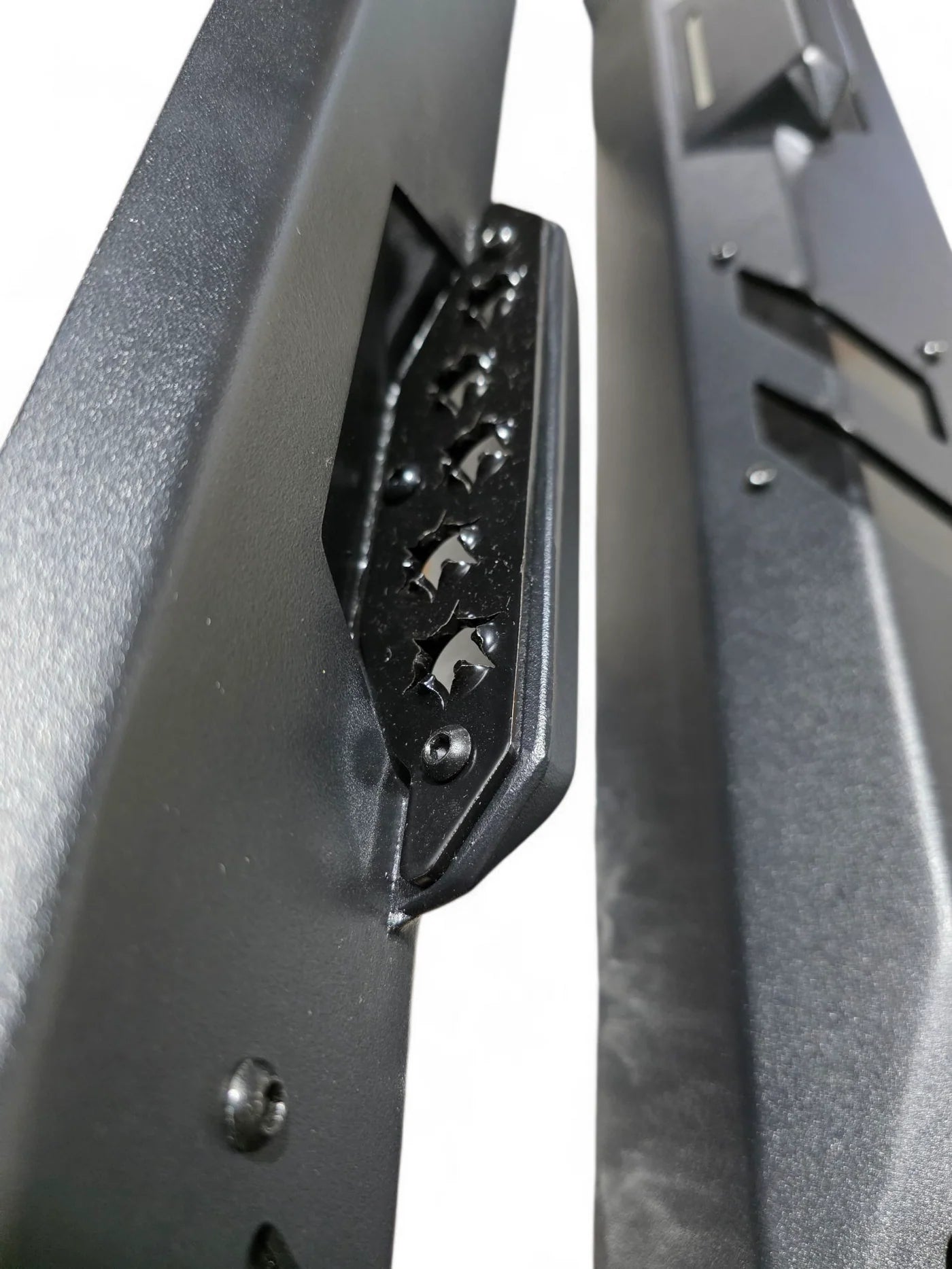 Close-up of a black metal tool with a textured surface