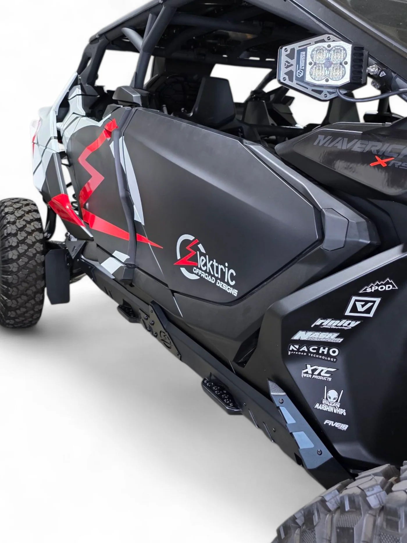 Side view of an off-road vehicle with visible branding on a white background