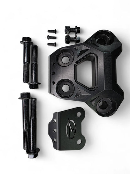 Black mechanical component with bolts on a white background