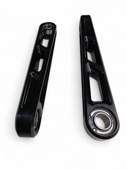 Two black metal connecting rods on a white background