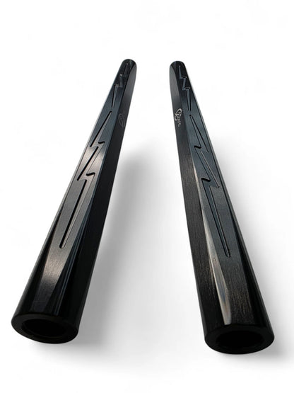 Two black luminum components on a white background