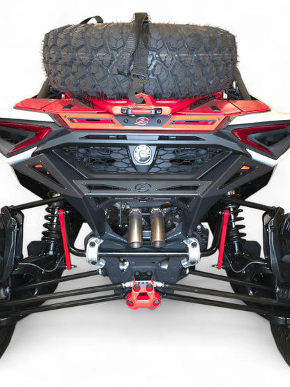 Close-up of a vehicle's undercarriage with visible suspension and branding on a white background