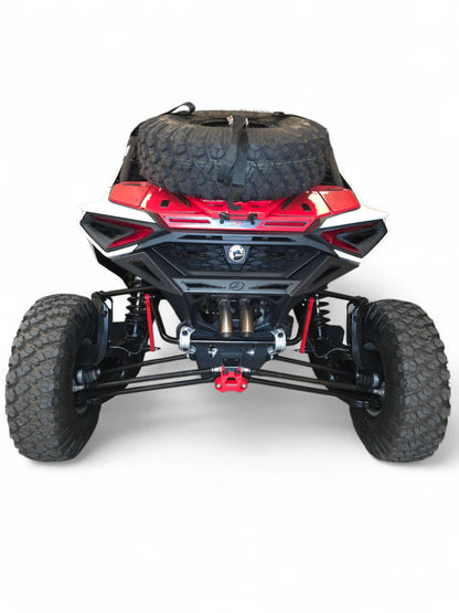 Back view of a red and black off-road vehicle with large tires on a white background