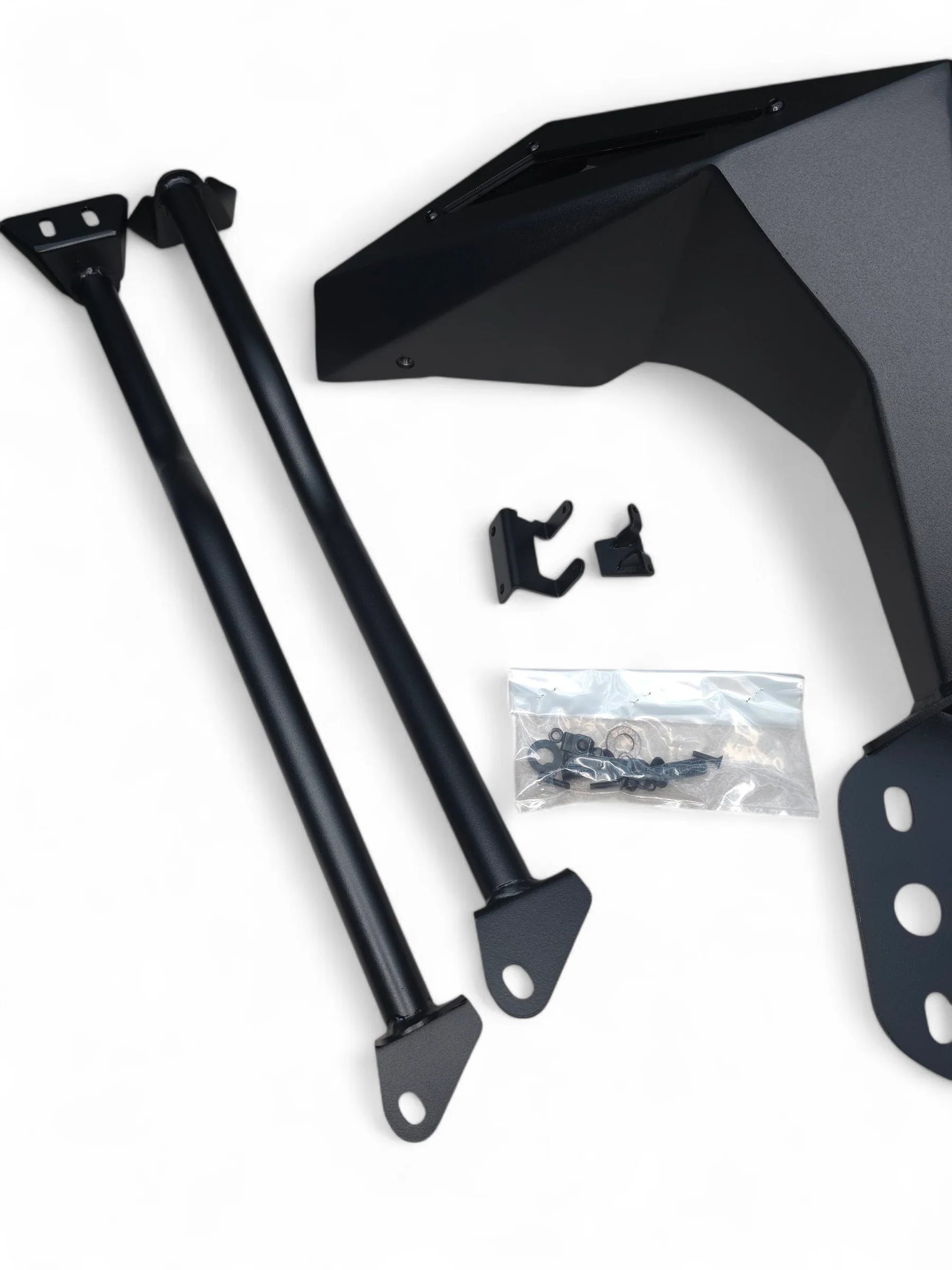 Black motorcycle fender and support structure on a white background