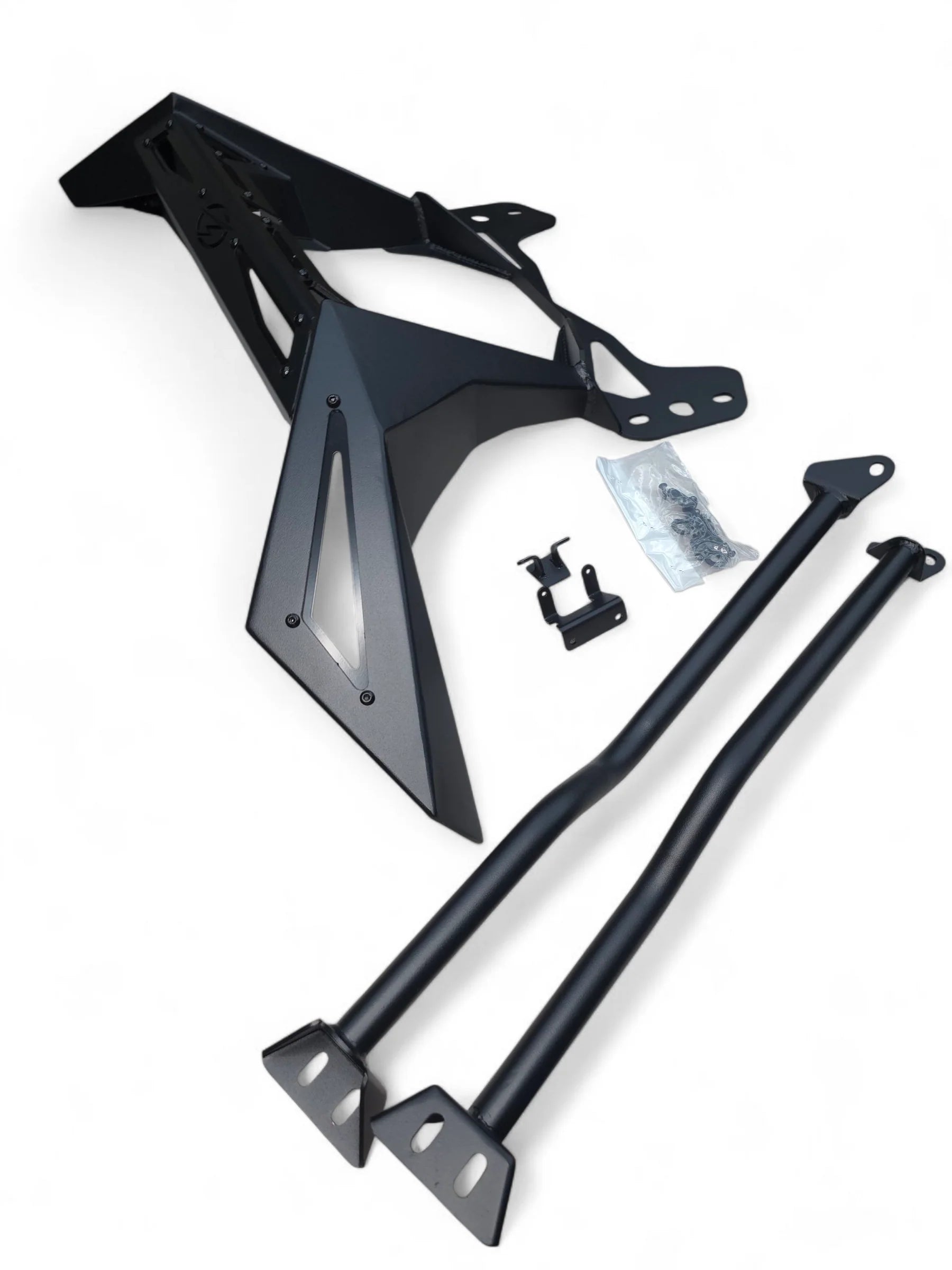 Black metal vehicle frame and components on a white background