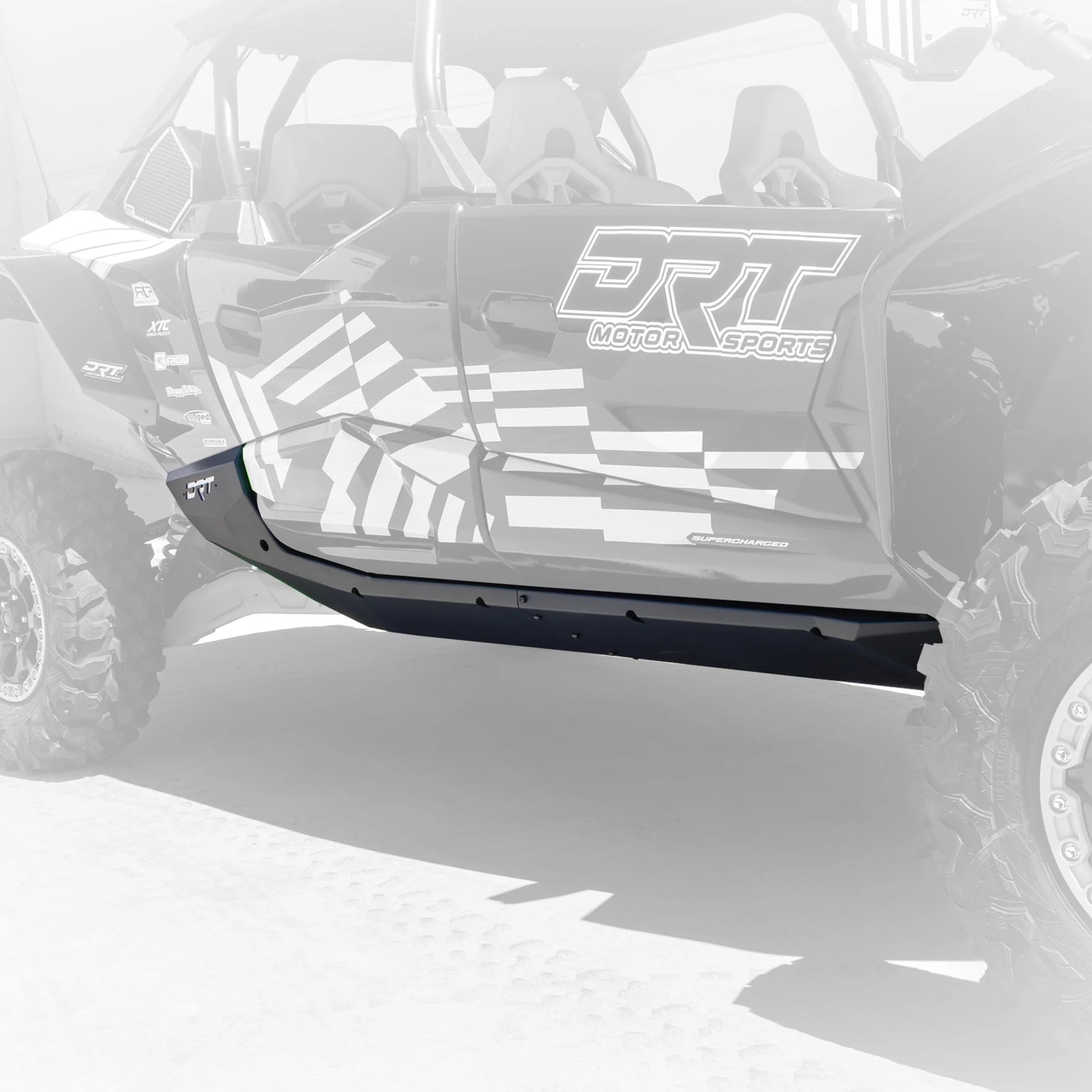 Black bumper on a vehicle with 'DRT Motorsports' branding.