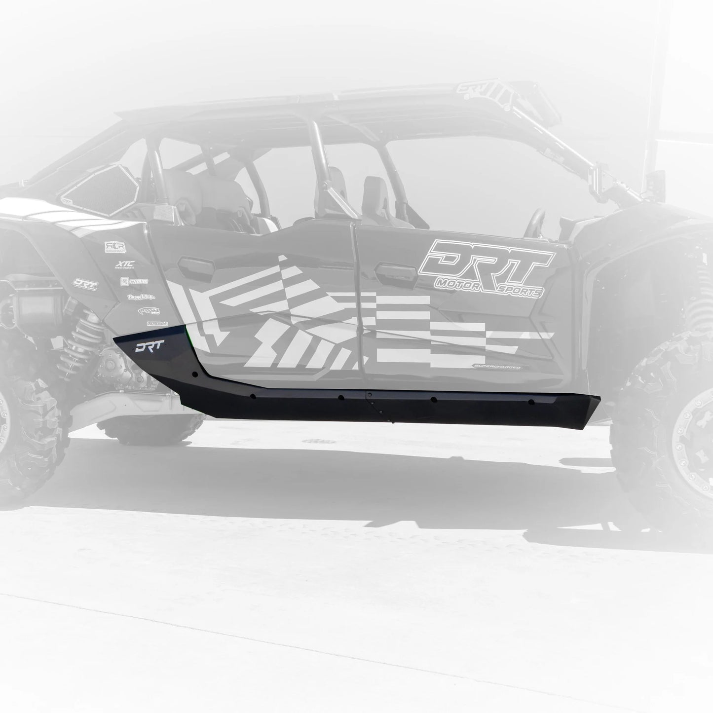 Black protective bumper on a vehicle with 'DRT' branding on a white background