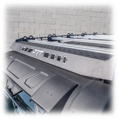Car roof rack system on a vehicle with a tiled wall background