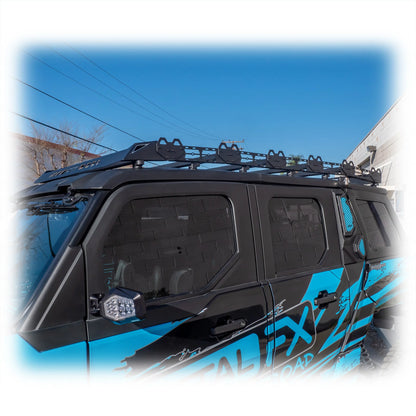 Black roof rack on a blue vehicle with clear sky background