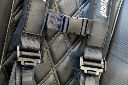 Close-up of a backpack with straps and a brand logo on a textured fabric background