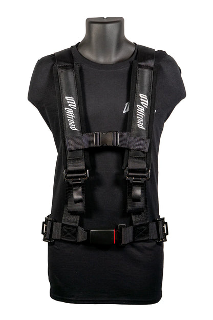 Black tactical vest on a mannequin with visible branding against a white background