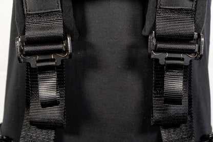 Close-up of black straps on a backpack with a blurred background