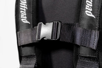 Close-up of a black backpack with visible branding on straps