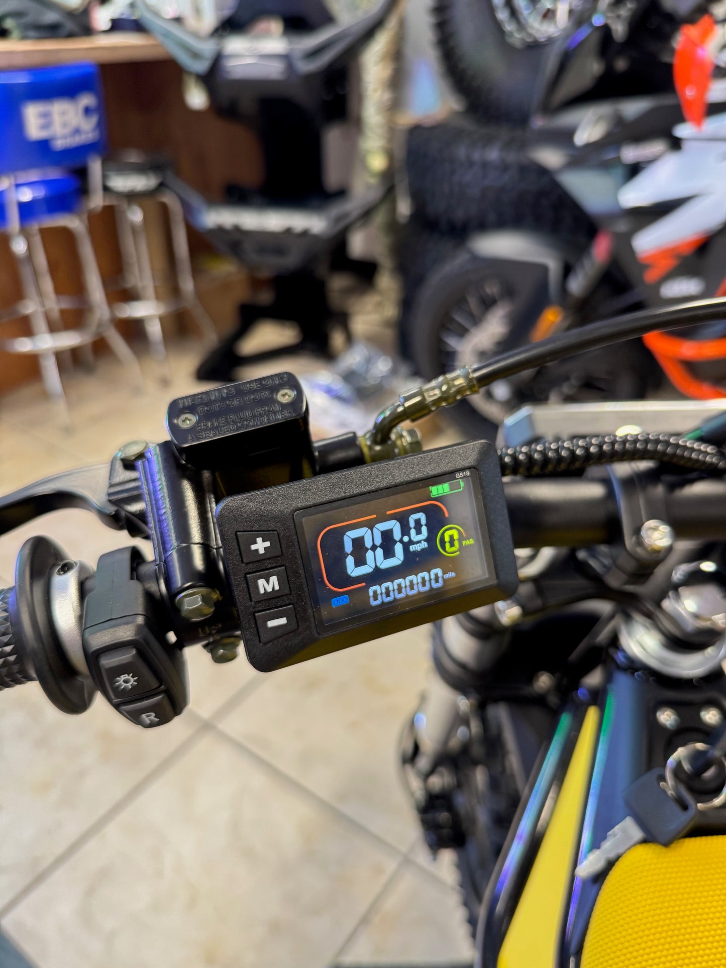 Digital meter attached to a motorcycle with a blurred background