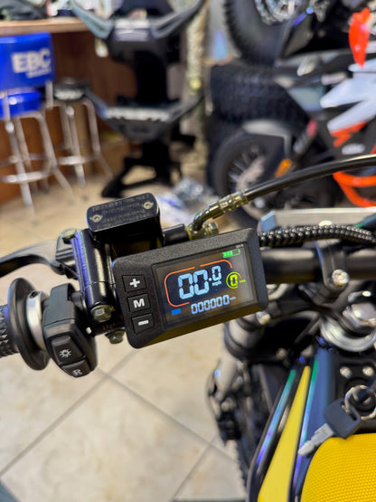 Digital meter attached to a motorcycle with a blurred background