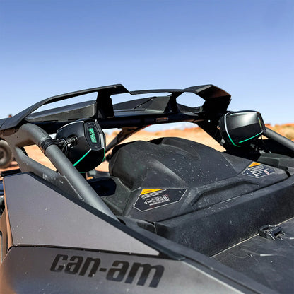 Close-up of a Can-Am vehicle in an outdoor setting with clear sky.