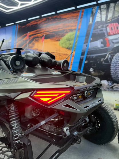 Close-up of a Polaris RZR XP 1000 ATV with a blurred indoor background