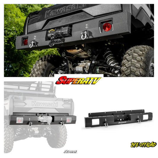 Kawasaki ATV with SuperATV bumper and lights, surrounded by greenery.