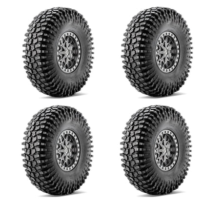 Four off-road tires with tread patterns on a white background