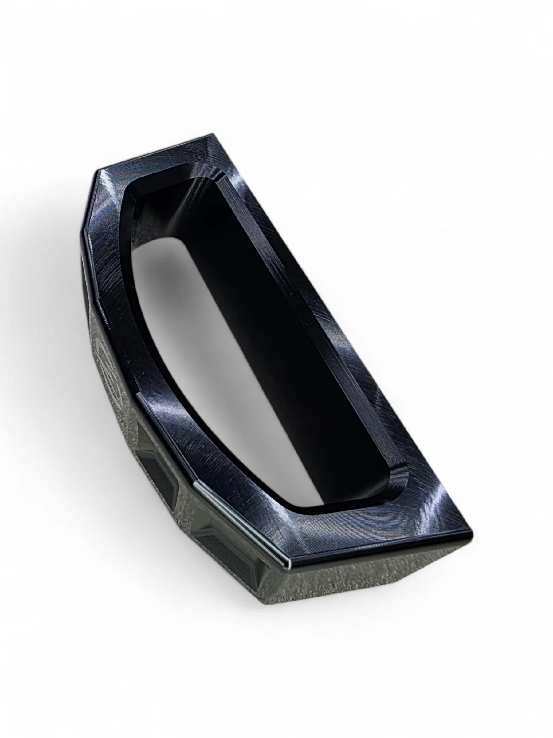 Black geometric object on a white background