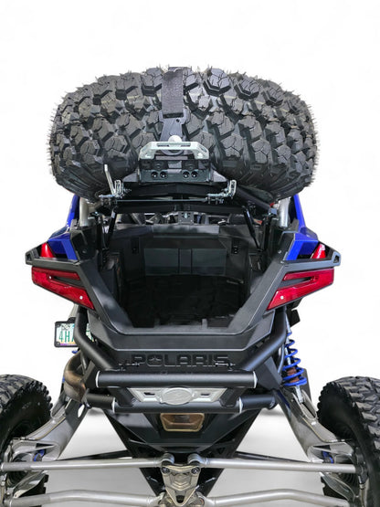 Back view of a Polaris vehicle with a large tire mounted on a white background
