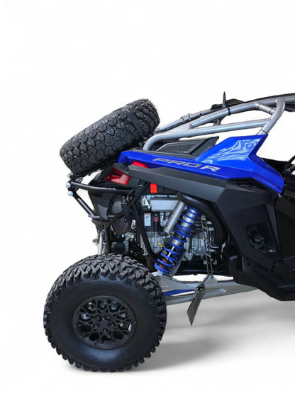 Blue and black off-road vehicle with large tires on a white background