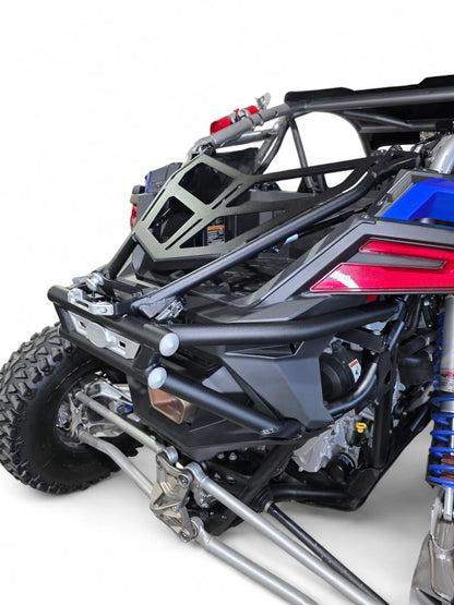 Close-up of a black off-road vehicle with visible suspension and bodywork on a white background