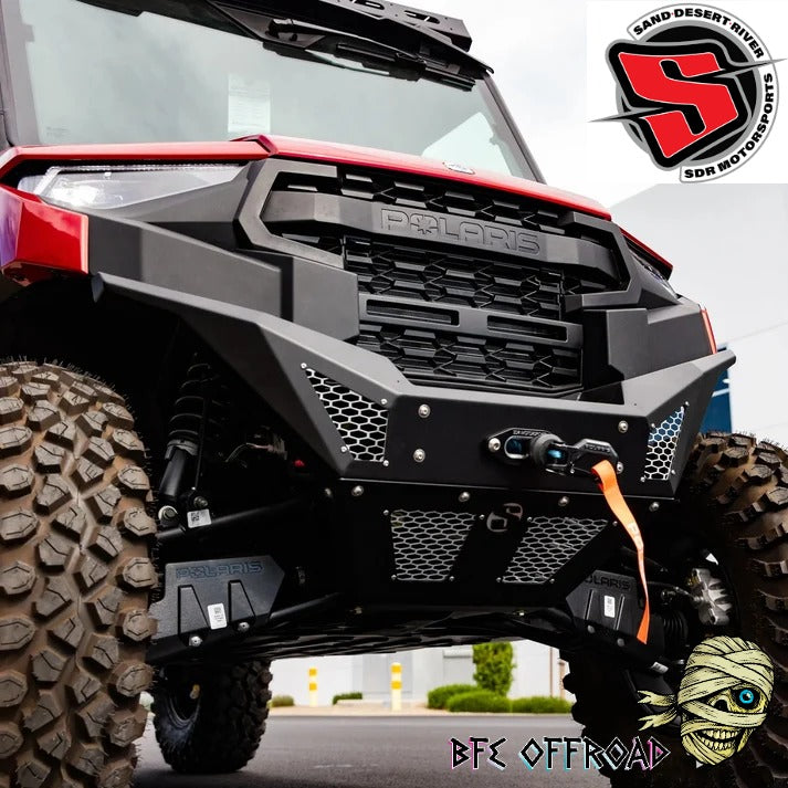 A close-up of a black metal front bumper and skid plate kit installed on a red and black Polaris side-by-side UTV, with off-road tires. The image features branding for 'BFE Offroad' and 'SDR'.