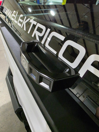 Black car bumper on a vehicle with ' Elektric' branding.