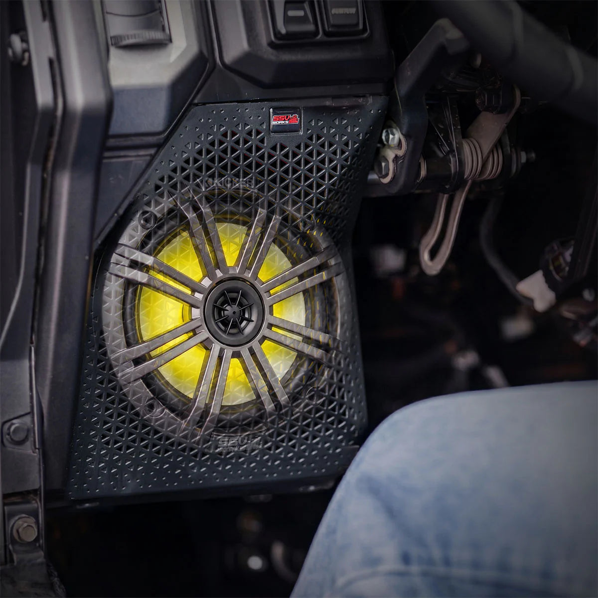 Close-up of a vehicle's engine bay with a yellow light