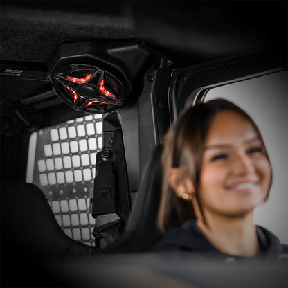 Person sitting inside a vehicle with a red light on the ceiling